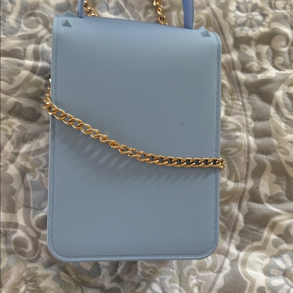 Blue crossbody with gold chain
So cute. Worn once - Picture 4 of 4